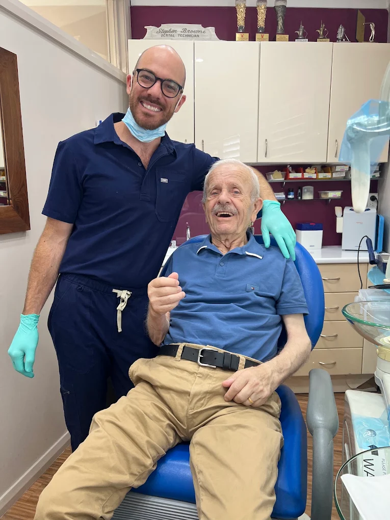 Mitchell Browne with a happy patient at Alpha Denture Clinic, Panania